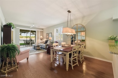 Dining space featuring dark wood-style floors, plenty of natural light, and ceiling fan