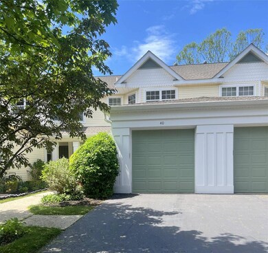 View of front of property with a shingled roof and