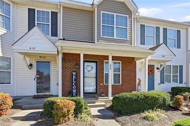 Front with brick & covered front porch