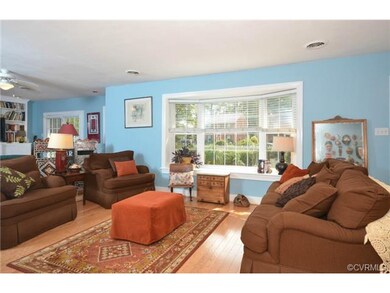 The bay window floods the living room with light!