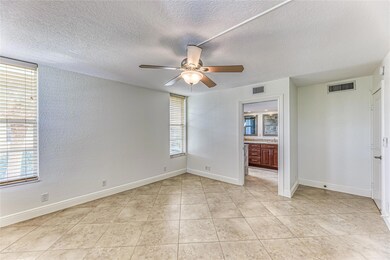 Two walls of windows in master bedroom offer great