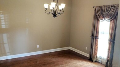 FORMAL DINING ROOM WITH HARDWOOD FLOOR.