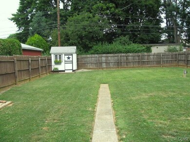 Large level back yard with shed