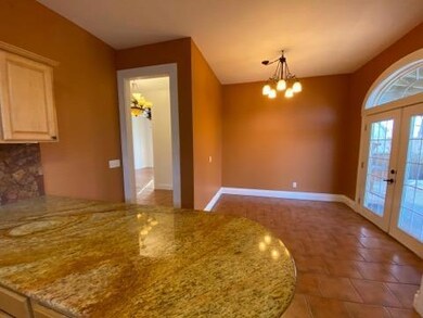 Kitchen features beautiful granite counter-tops.