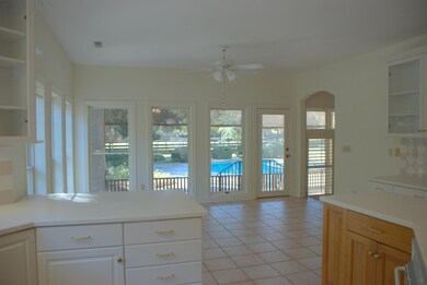 large kitchen area looking to pool