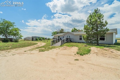 View of front of property with dirt driveway