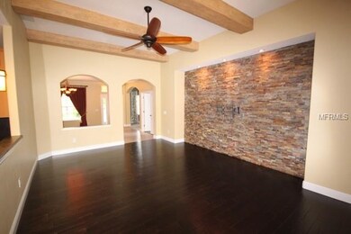 Family room with stone wall