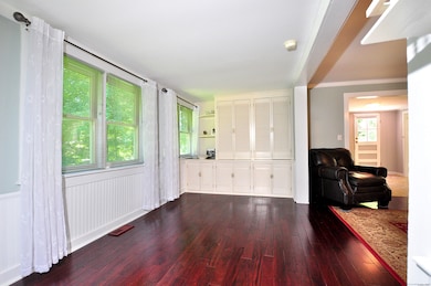 Enclosed former porch is used as a family room or living room