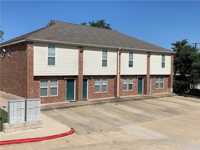 Townhome / multi-family property featuring brick s