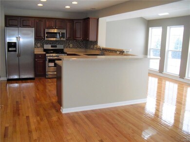 Kitchen with breakfast bar opens to morning room &