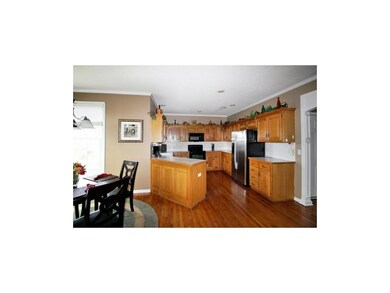 Kitchen with hardwood floors and walk-in pantry