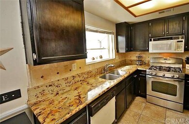 The kitchen features upgraded granite counter tops