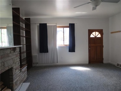 First floor unit living room with updated carpet, 