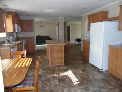 KITCHEN TOWARD LIVING ROOM AND DINING
