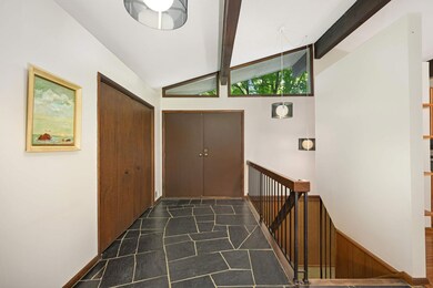 From the moment you walk through the double doors you will love the mid-century modern feel of this one owner home.