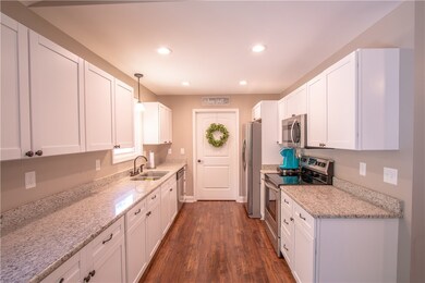 kitchen with shaker style cabinets and granite cou