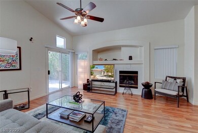 Living room has gas fireplace and access to backya