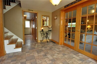 Large, open foyer ....glass doors is entry into fa