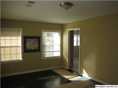 Cozy living room with refinished dark-stained hard