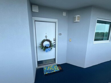 View of exterior entry featuring stucco siding