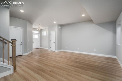 Unfurnished living room featuring light hardwood /