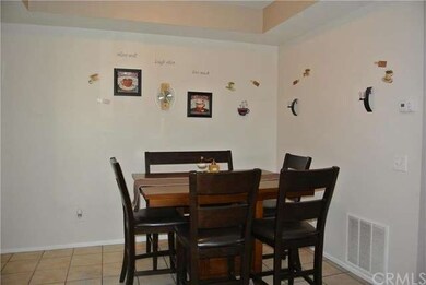 Formal dining with tile flooring