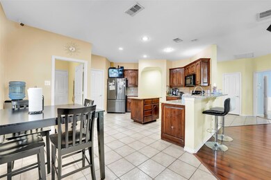 Kitchen featuring kitchen peninsula, stainless ste