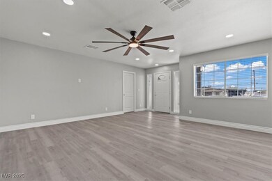 Unfurnished living room featuring visible vents, b