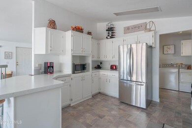 Kitchen with stainless steel fridge