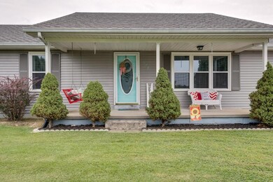 COVERED FRONT PORCH TO SIT AND ENJOY THE VIEWS