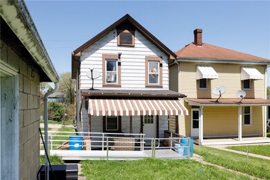 Accessible Entrance in the rear of the home, with a nice flat back yard.