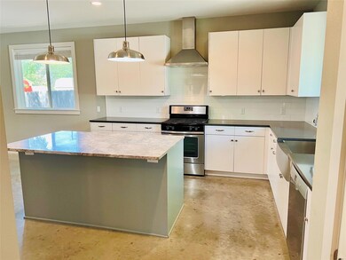Kitchen featuring appliances with stainless steel