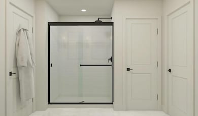 Primary bath with glass shower enclosure