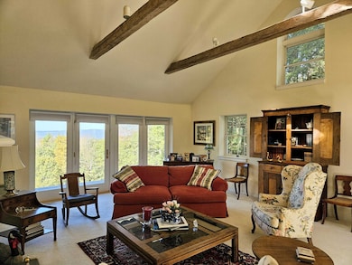 Fabulous living room with long range views,brick fireplace & cathedral ceiling