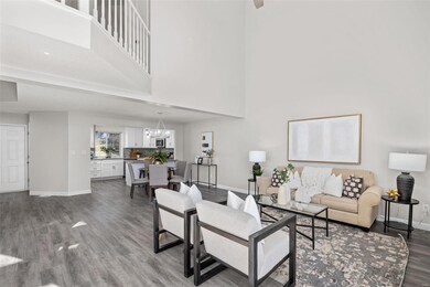 Lots of space in this Great Room open to the dining and kitchen!