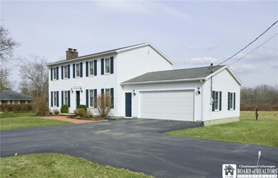 Attached 2+ car garage...Blacktop driveway with tu