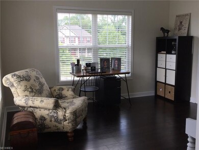 Step into the formal living room with wood floors 