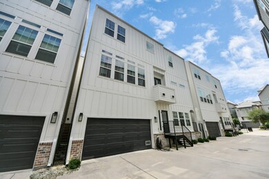 Modern townhouse with a clean, white exterior and