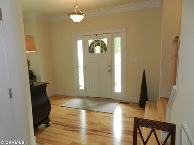 Foyer - View of foyer with Hickory wood floors the entire first floor and Custom millwork entire first floor.