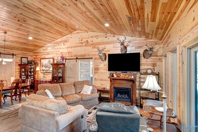 Great room with vaulted ceilings and gas log fireplace.