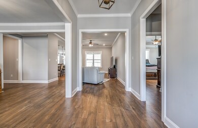Entrance foyer with dark wood-type flooring and ce
