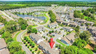 Drone / aerial view featuring a water view and a r