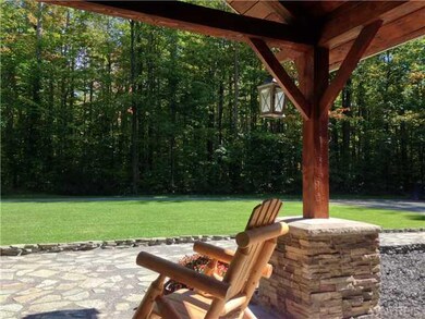 Exterior Front. Timber-Frame style entryway with b