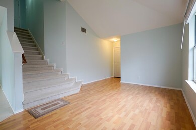 Unfurnished living room featuring visible vents, 