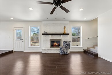 Spacious living room with hidden stairway to secon