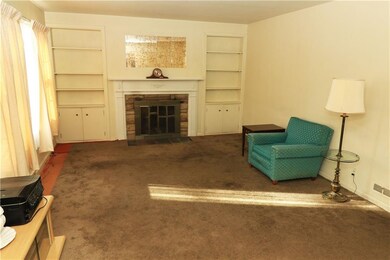 Spacious living room with hardwood floors reported