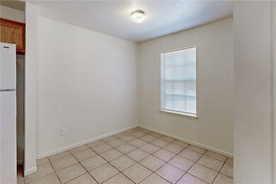 Spare room with light tile patterned floors