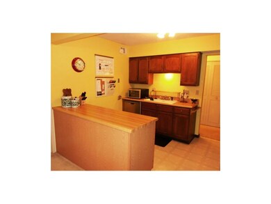 Bright, open kitchen offers plenty of storage and 