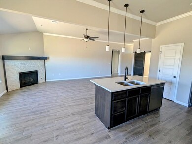 Kitchen featuring light countertops, stainless ste