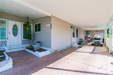 Carport will fit 2 cars.